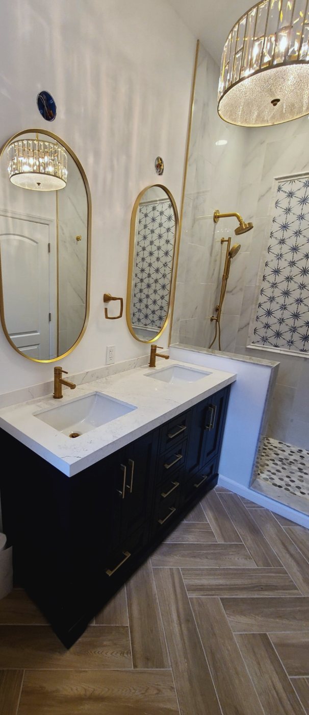 Navy double vanity with gold fixtures