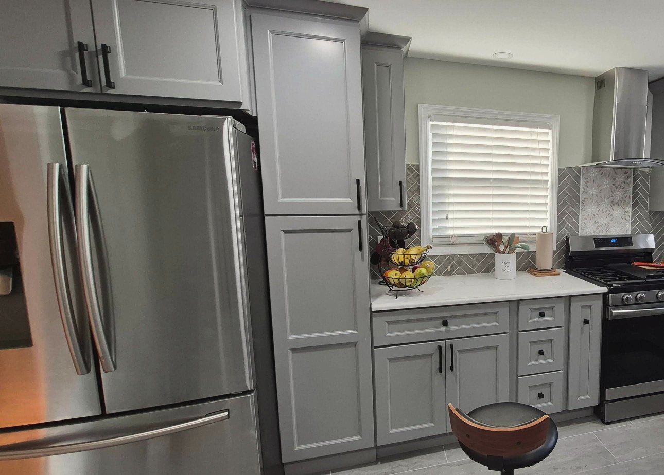 Gray kitchen with herringbone backsplash